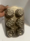 Pioneer Woman Nordic Ware Heavyweight Cast Aluminum Floral Cakelet Pan - New. Price: $30.00.