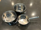 Wolfgang Puck Bistro Collection Stainless Steel Pots 3.5, 6 And 8 Qt 1 Lid Used. Price: $40.00.