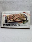 Vintage Pyrex Designs Party Server 3 Qt Baking Dish With Brass Accent Cradle Used. Price: $25.00.