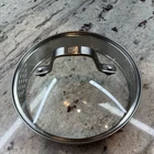 Calphalon Glass Stainless Steel Replacement Strainer Lid Inner 6 3/8 Outer 7" Used. Price: $10.50.