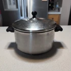 Farberware 18/10 Stainless Steel Impact Bonded 6 Qt. Quart Stock Pot With Lid Used. Price: $19.99.