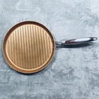 Cooks Essentials 12 Inch Round Copper Coated Cast Iron Grill Pan Strong Handle Used. Price: $24.95.