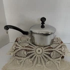 Farberware Stainless Steel Aluminum 1 Qt Saucepan With Dual Pour Spouts And Lid Used. Price: $19.99.