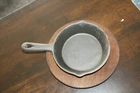 Vintage Tomlinson Cast Iron Skillet 4" Oal 6" W/ Wood Base Used. Price: $14.95.