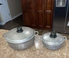 2 Imusa Cast Aluminum Pans With Lids 10" X 4" Tall & 7" 3" Used. Price: $34.95.