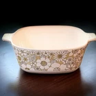 Corningware 1/2 Qt Square Casserole W/ Handles White/gold Floral Used. Price: $10.00.