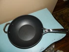 Creuset Toughened Nonstick Pro Stir Fry Pan With Helper Handle, 12" H22018 New. Price: $159.95.