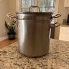 Kirkland Signature Professional 12 Qt Stock Pot W/ Steamers & Lid Used. Price: $139.00.