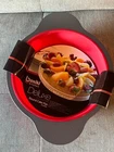 Boxiki 9 Inch Nonstick Silicone Round Cake Pan With Steel Frame Handles New. Price: $34.99.