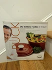 Wolfgang Puck Black 5 Qt Cast Iron Dutch Oven Enamel Coating, Self-basting Cover New. Price: $65.00.