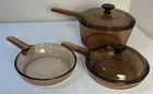 Lot Of Pyrex Visions France Amber Glass Saucepan Set W/ Lids 2.5QT & 1.5QT Used. Price: $69.99.