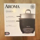 Aroma ARC-743-1NGB Rice Cooker & Steamer 6-CUP Cooked 350W Black 2-SETTING New. Price: $19.00.