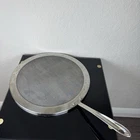 All Clad 13 Inch Stainless Steel Splatter Screen Guard Cover With Handle Used. Price: $29.95.