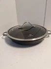 Calphalon 1382 12" Sloped Sides W/glass Lid Used. Price: $39.00.