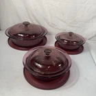 Set Of 3 Pyrex Vision Glass Cookware Cranberry With Lids Used. Price: $119.93.