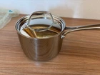 New Tramontina Signature Tri-ply Clad 2 Qt. Stainless Steel Sauce Pan With Lid. Price: $45.00.