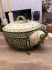 Temptations Oval Ceramic Casserole Dish With Lid, Wire Holder, Green Motif Used. Price: $20.00.