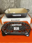 Le Creuset Flint Oyster Cast Iron Signature Roaster 5.25 Qt 4.9L & Oval Trivet New. Price: $399.50.