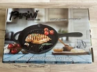 Parini 10" Cast Iron Grill Pan New. Price: $12.52.