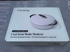 Caraway Home Enameled Cast Iron Braiser With Lid, Light Mist New. Price: $190.00.