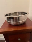 Creuset Stainless Steel Steamer Insert Vares From 9" To 6" Diameter 3.5" Tall Used. Price: $75.00.
