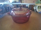 Visions Corningware 1156 Cranberry Glass 2.5 Dutch Oven 2-HANDLED & Lid Purple Used. Price: $25.00.