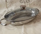 Wolfgang Puck Bistro Collection 12.25 " Oval Casserole Stainless Pan W/ Handles Used. Price: $19.99.
