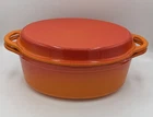 Vintage Le Creuset Orange Enamel Oval Dutch Oven With Cast Iron Grill Pan Lid 28 Used. Price: $200.00.