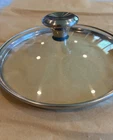 Creuset Tempered Glass Lid W/stainless Steel Knob, Safe; For 9 Pan Used. Price: $30.00.