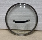 Simply Calphalon Pot/pan Lid 9" X 8 1/2" Stainless Steel W/black Rubber Used. Price: $9.99.