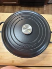 Creuset Black Enameled Cast Iron 11 In Round Braiser, Lid, Double Handle Used. Price: $275.00.