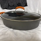 Rachael Ray Anodized Non Stick Oval Saute Pan W/lid Orange Handle 13.5 X 9 Used. Price: $64.99.
