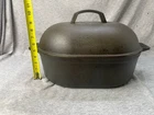 Bayou Classic 7418 12-QT Cast Iron Oval Roaster W/ Domed Lid LB223 Used. Price: $65.30.
