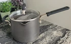 Calphalon 1/2 Quart Hard-anodized Nonstick Saucepan Pot W/ Strainer Lid 8704 Used. Price: $30.00.