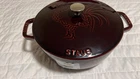 Staub Cast Iron 3.75 Qt, Essential French Oven Rooster Lid, Grenadine New. Price: $220.00.