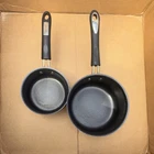 Cuisinart Two-piece Red Non-stick Saucepan Set With Black Handles Used. Price: $10.00.