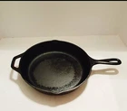 Lodge 10.25" American Flag Cast Iron Skillet Used. Price: $20.00.