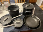 10 Piece Commercial Calphalon Anodized Aluminum Cookware Set 7 Pans - 3 Lids Used. Price: $125.00.