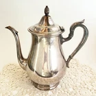Vintage Reed & Barton Silver Plate Tea Pot W/hinged Lid Pineapple Finial. Price: $24.00.