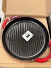 Staub France Cast Iron 10'' Round Double Handle Pure Grill Red Grenadine New. Price: $109.99.