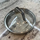 Calphalon Strainer Lid Tempered Glass & Stainless Replacement 5 3/8" Inside Lip Used. Price: $8.50.