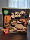 New Box Old Stock Corningware Spice Of Life Skillets And Sauce Pan Set. Price: $100.00.