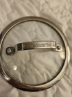 Cuisinart Glass Pan Lid With Metal Handle & Rim 9 " Used. Price: $10.00.