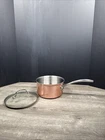 Calphalon Stainless Steel 1/2 Quart Saucepan & Lid 87022 Copper Outside Used. Price: $29.99.