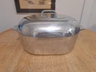 Vintage Wagner Ware Magnalite 13 Quart 4267-P Dutch Oven Roaster With Trivet Used. Price: $279.99.