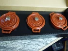 Staub 3 Piece Enameled Cast Iron Mini Round Cocottes, Nib, Red Orange New. Price: $275.00.