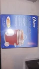 Oster 6-CUP Rice Cooker With Steamer, Red (004722-000-000) New. Price: $50.00.