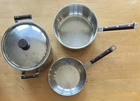Cuisinart Stainless Steel Three-piece Cookware Set With Wood Handles & Lid Used. Price: $120.00.