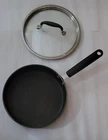 Pampered Chef 10 In Skillet: Hard-anodized Nonstick, Black, W/lid Used. Price: $39.95.