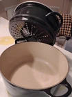Rare Creuset 24CM Dutch Oven Complete With Lid And Steamer Basket Black 4.5QT Used. Price: $200.00.